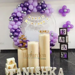 A half-ring balloon frame in purple and silver. This is a great option when you want a stylish backdrop without a full arch.