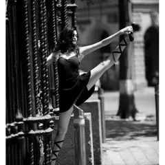 An extension pose, demonstrating the control and technique learned from classical ballet and jazz. This foundation allows for more dynamic and impressive choreography.