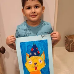 This is the moment I work for. The pure pride and joy on this young artist's face after independently creating his own party cat artwork is what our classes are all about.