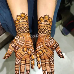 This full-hand design combines classic Indian motifs like elephants and lotuses with geometric patterns. The result is a rich and textured look that extends up the arm.