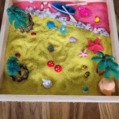 Another beautiful creation, this Zen garden uses yellow and pink sand to create a vibrant landscape. This sensory activity helps children practice focus and express themselves creatively.