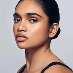 Snatural! This look is all about that snatched and natural effect. With a sleek bun and glowing skin, the makeup enhances the model's bone structure for a polished and sophisticated finish.