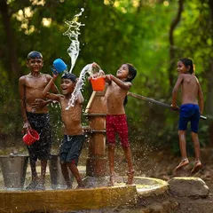 The pure energy of a village summer, frozen in time. This shot from my "Childhood Summers" series captures the simple, uninhibited happiness of kids playing near a handpump in rural Maharashtra.
