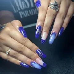 A bold and beautiful royal blue set with a mix of textures and a gold buckle accent.