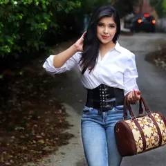 A classic and stylish look, pairing a white shirt with a corset belt and jeans. This demonstrates my ability to style and model for smart-casual and accessory brands.