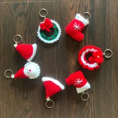 A variety of my Christmas keychains, including Santa hats, stockings, and wreaths. They are an adorable addition to any holiday gift.