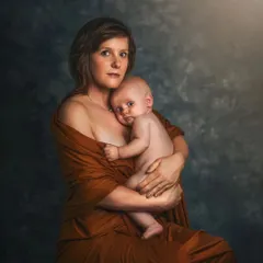 This classic mother-and-child portrait, with its soft lighting and gentle embrace, is inspired by the Old Masters. It’s an image designed to be an heirloom, cherished for generations.