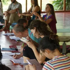A student concentrates on her notes during a theory session in our yoga shala. We believe that a strong intellectual understanding of yoga philosophy and anatomy is essential for becoming a confident and knowledgeable teacher.