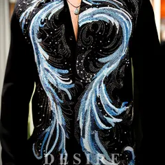 This is where art meets opulence. I crafted this black shirt with cascading waves of blue and silver embroidery, creating a sense of motion and cosmic energy. It is a luxury piece for a man who is a force of nature.