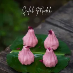Celebrate with our fragrant Gulab Modak. These beautiful pink modaks are infused with the delicate flavour of rose petals, a special treat for Ganpati.