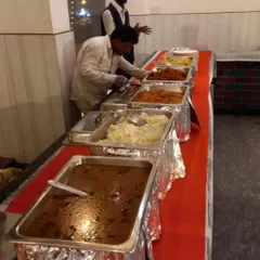 Here is a look at one of our buffet setups for a dinner event. We provide a full spread of our dishes in professional chafing dishes, ensuring the food stays hot and is presented beautifully for your guests to enjoy.