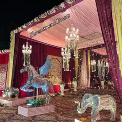 A magical, fantasy-themed setup featuring illuminated crystal statues of a winged horse and elephants, creating an ethereal atmosphere.