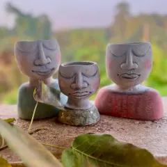 A small family of custom planters I made for a client. Each one is hand-sculpted with its own peaceful expression, designed to bring a little bit of calm and nature into your home.