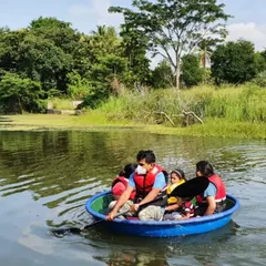 Experience a traditional coracle ride, a unique bowl-shaped boat that offers a stable and gentle way for a family or small group to explore the Kabini river together.