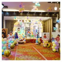 A princess party fit for royalty! This grand setup for Divisha's first birthday features multiple balloon arches, character cutouts, and personalized photo displays, transforming the venue into a fairytale kingdom.
