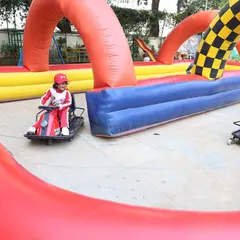 The mini go-kart track was the star attraction of this outdoor party. I can arrange for these exciting rides to give kids a real racing experience in a safe, inflatable environment.