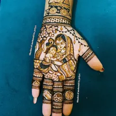 A devotional take on a baby shower theme, with a portrait of Maa Yashoda and little Krishna. The design also includes cute baby-related motifs on the fingers.