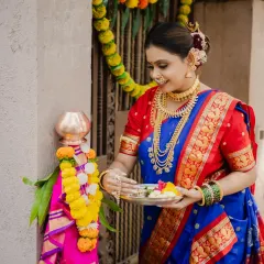A full-length portrait capturing the complete festive look for Gudi Padwa. The model's elegant pose showcases her beautiful traditional saree and the decorated Gudi, creating a perfect festive memory.
