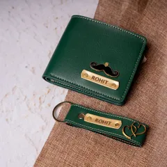 Here is a matching wallet and keychain set in a rich forest green faux leather. Both items are personalized with the name "Rohit," and the wallet features a mustache charm while the keychain has a double-heart charm.