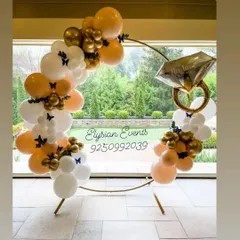This is my popular ring ceremony backdrop, perfect for engagement parties. The design features a large golden ring frame decorated with an organic balloon garland in white and gold, accented with a large diamond ring foil balloon to celebrate the occasion.