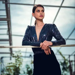 A punchy, high-contrast outdoor portrait. Even outside the studio, I use lighting techniques to create a dramatic, sculpted look that makes the subject stand out against the sky.