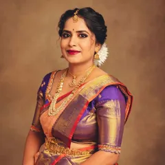 A classic portrait that brings focus to the subject's expression and the upper portion of the attire. The soft lighting highlights the sheen of the silk and the warmth of her smile.