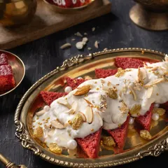 This is not your average mithai. I shot this Red Velvet Shahi Tukda with dark, moody lighting and a vintage brass platter to give it a luxurious and gourmet feel, blending tradition with modernity.