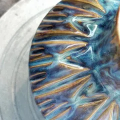 The colors on this pitcher make it one of my favorite pieces. The way the glazes melted and flowed in the kiln created these yummy flashes of blue, purple, and yellow. It’s pure kiln magic.