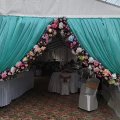 The entrance to a corporate event for Columbia Sportswear. We created a welcoming floral arch over a draped entryway to greet guests and set a celebratory tone for the office opening.