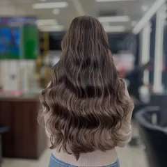 Serving ice-cold elegance with this ash blonde beauty. Created using Keune, this look features a beautiful blend of cool, ashy tones for a sophisticated finish.