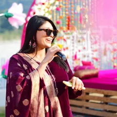 A candid shot of me doing what I love most. With a microphone in hand and a smile on my face, I am ready to make your wedding events energetic and full of life.