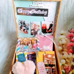 A bright and cheerful birthday hamper, packed with personalized photo items and colorful goodies.