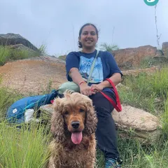 A happy Cocker Spaniel and his parent taking a break during our hike. We ensure a comfortable pace for everyone, with plenty of stops to rest and soak in the views.