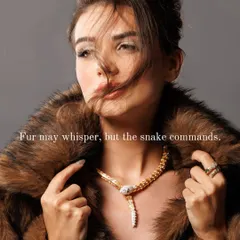 The full story comes together in this shot. The model's pose, the texture of the fur, and the commanding presence of the serpent necklace create a complete narrative. This is how we build a world around a product.