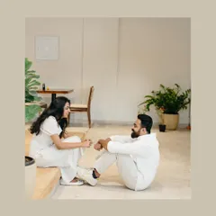A candid, playful moment in a modern, minimalist indoor space. This shows how simple settings can be perfect for capturing genuine connection and fun.