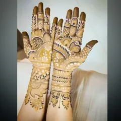 Another angle of the same intricate design, showing the details on the fingers and wrist.