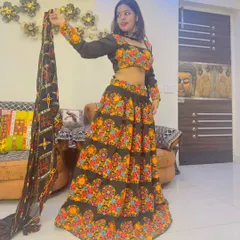 A full-length view of our black lehenga with vibrant multi-color floral embroidery. The matching embroidered dupatta completes this stunning look for Dandiya.