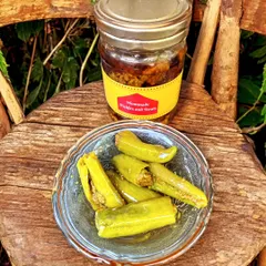 For those who love a bit of spice, I make this Stuffed Hari Mirchi Achaar. Each green chilli is carefully slit and filled with a tangy masala mix before being pickled. It has a wonderful crunch and a fiery kick that really livens up a meal.