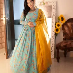 This light blue floral Anarkali with a contrasting yellow dupatta is a beautiful and breezy option for a day wedding. It’s an elegant ethnic outfit that is both comfortable and photogenic.