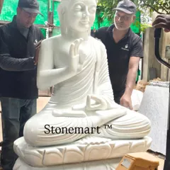 Here our team carefully handles a monumental 5-foot, 1-ton Buddha statue. This demonstrates the scale and substance of our work, as each large garden Buddha statue is carved from a solid block of white marble for unmatched durability and presence.