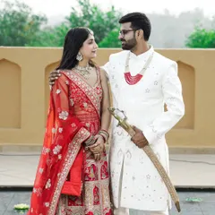 Celebrating your roots is beautiful. This portrait captures the regal elegance of traditional Indian attire. The rich colors of the lehenga and sherwani against a classic backdrop make for a truly timeless pre-wedding photograph.
