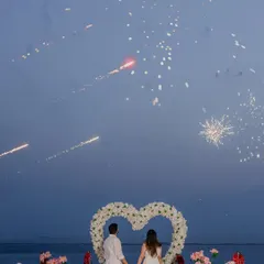 A magical proposal moment set against the Mumbai shoreline. We coordinated this shot with fireworks to create a truly spectacular and unforgettable memory, framed by a heart of white roses.