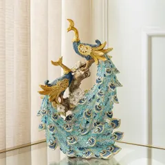 This twin peacock showpiece adds a touch of royalty and elegance to your space. The two birds are perched on a branch, their blue and gold feathers creating a harmonious and sophisticated display.