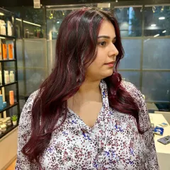 Sassy, classy, and cherry red. This client is rocking her new color, which we chose to complement her warm skin tone.
