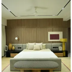 This is what I call a master suite. From the custom wood-paneled feature wall and integrated bedside lighting to the plush, comfortable furnishings, every detail in this penthouse bedroom is crafted for ultimate relaxation and style.
