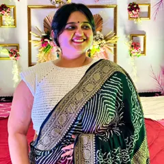 My mom smiling while wearing the white crochet blouse. It fills me with so much pride and joy to see my family wearing and loving my creations.