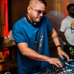 Focused on the mix at The Fixx. I blend Bollywood classics with fresh techno beats to create my signature sound that keeps you guessing.