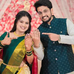 The moment it becomes official. Shraddha and Vivek playfully show off their new engagement rings, a fun and celebratory shot that captures the excitement of the day.