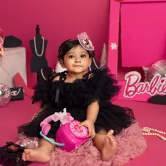 Come on Barbie, let's go party! This little fashionista is living her best life in a Barbie-themed world, complete with a pink phone and all the glamorous accessories.