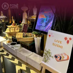 Our live sushi station is a popular choice for corporate events, offering a fresh and healthy option. The setup includes a variety of rolls, condiments like wasabi and pickled ginger, and a digital menu for easy selection.